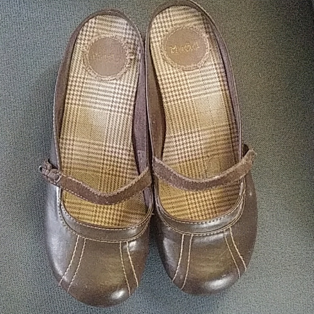 Mudd brown slip mule on women's shoe.